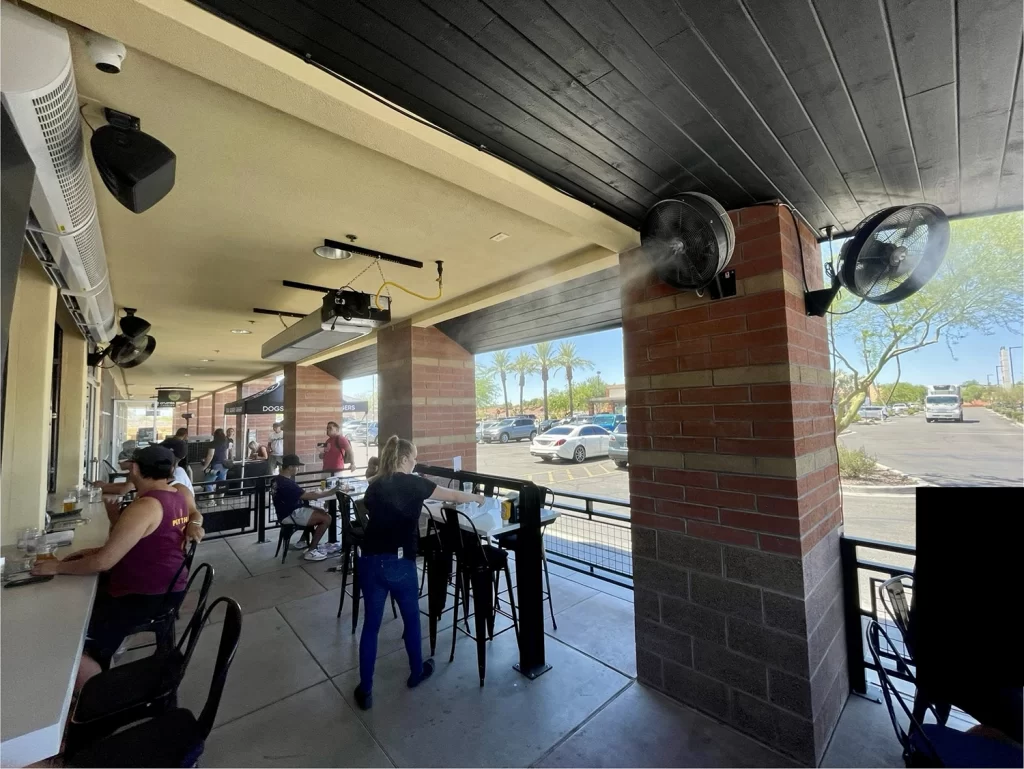 Element Mist Commercial Misting System solutions - an outdoor patio with a fan misting system